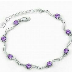 A Delicate Plated Sterling Sliver Bracelet With Amethyst Cz. Length Is 6.25" Exspandable To 8.25" The Unique Link Design Gives This Bracelet Its Beauty. Elegant Silver Tennis Bracelet With Amethyst, Elegant Silver Amethyst Tennis Bracelet, Elegant Silver Tennis Bracelet, Sterling Silver Amethyst Bracelet For Anniversary, Chunky Silver Bracelet, Dragon Bracelet, Link Design, Swarovski Bracelet, Sterling Bracelets