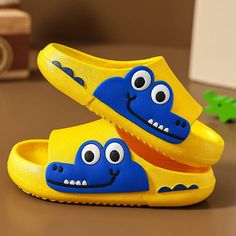 These kids' cartoon crocodile slippers are made for comfort on the beach or around town. With a lightweight construction and a range of styles, these popular crocodile slippers will have your tot's feet smiling all day long. Outsole Material: EVALining Material: PVC Cartoon Crocodile, Slipper Bath, Summer Soft, Slippers Summer, Kids Slippers, Fashion Slippers, Yellow Shoes, Home Bathroom, Baby Slippers