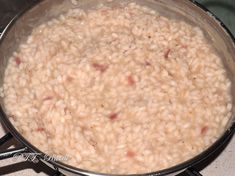 a pot filled with rice on top of a stove