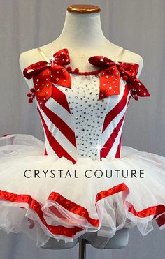 a red and white dress with bows on it