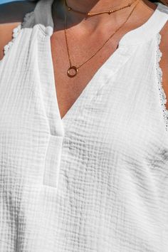 Refresh your style with our White V-neck Lace Trims Sleeveless Top. Its chic design exudes charm and sophistication, perfect for layering or wearing solo on warmer days. With its flattering neckline and intricate detailing, this camisole effortlessly elevates your wardrobe with timeless style. Product code: CAA04A4B007CC Features:  Woven Sleeveless V neckline Ruching Lace Trims Wash Method: Regular Wash Material: 100%COTTON. Chic V-neck Tank Top For Vacation, Elegant V-neck Tank Top For Vacation, Chic Sleeveless V-neck Top For Summer, Chic V-neck Camisole For Day Out, Chic Beach Vest In Camisole Style, Chic Beach Vest Camisole, Chic Camisole Vest For Beach, Chic Camisole Vest For The Beach, Elegant V-neck Tank Top For Summer