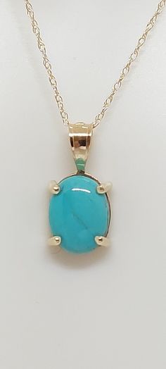 TURQUOISE Pendant / Necklace /Charm in 14k Yellow Gold 18 Inches Rope Chain. 14k Yellow Gold Oval Turquoise Pendant. Real Turquoise Stone. Product Info: -Stone: Natural Turquoise. -Metal: 14k Yellow Gold. -Pendant Measures: 13 x 5mm. -Turquoise Measures: 7x5mm -Chain length: 18 Rope Inches. -Made in USA. -Nice Gift Box Included. Gold Oval Turquoise Gemstone Necklace, Gold Turquoise Oval Necklace, Fine Jewelry Turquoise Oval Necklaces, Oval Turquoise Necklace In Yellow Gold As Gift, Fine Jewelry Oval Turquoise Necklace, Yellow Gold Oval Turquoise Necklace Gift, Oval Yellow Gold Turquoise Necklace As Gift, Sleeping Beauty Turquoise Jewelry, White Topaz Necklace