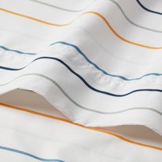 an image of a close up view of a white and blue striped fabric with vertical stripes