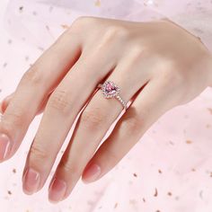 Jeulia Halo Heart Cut Synthetic Morganite Sterling Silver Ring - Jeulia Jewelry Pink Jewelry With Halo Setting For Proposal, Pink Heart Cut Jewelry With Halo Setting, Pink Open Heart Ring For Wedding, Elegant Rose Gold Heart-shaped Crystal Ring, Elegant Heart Shaped Ring With Halo Design, Elegant Heart-shaped Ring With Halo Design, Elegant Heart Shaped Halo Ring, Elegant Heart-shaped Halo Ring, Pink Halo Setting Jewelry For Valentine's Day