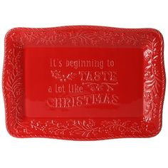 a red tray with the words it's beginning to taste a lot like christmas