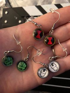 Handmade Marvel Inspired Stainless Steel Earrings—Choose Your character Nickel-free Themed Stainless Steel Jewelry, Themed Nickel-free Stainless Steel Jewelry, Nickel Free Themed Black Jewelry, Novelty Black Round Jewelry, Black Round Novelty Jewelry, Avengers Jewelry, Avengers Merchandise, Marvel Earrings, Movie Character Outfits