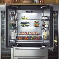 an open refrigerator filled with food and drinks