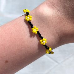 ♡ Black and yellow flower seed bead bracelet. Single bracelet. ♡ Fits ~16 cm wrists. Second photo is shown for bead scale! ♡ Made with elastic string, so allows stretching, but please be gentle! ♡ NOT made in a pet-free household Yellow Beaded Bracelet, Flower Seed Bead, Bead Things, Single Bracelet, Black Beaded Bracelets, Seed Bead Bracelet, Black Flower, Seed Bead Bracelets, Black And Yellow