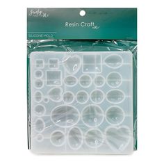 a package of clear plastic crafting supplies with white circles on the front and bottom