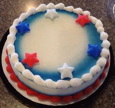 a cake decorated with red, white and blue stars