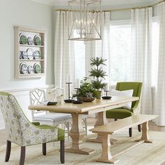 a dining room table with two chairs and a bench