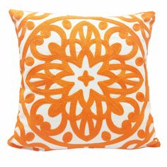 an orange and white pillow on a white background