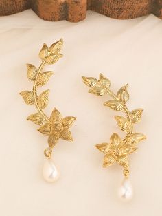 ♥ Leaves and flower Earring ♥ Very beautiful long ear wraps. Floral design in 18k gold plating. Inspired by the garden of eden this flower shaped earrings will surely add class to your attire. Our Leaves and flower Earring are fashioned out of brass and embellished classy pearl. Be it a dinner or any formal occasion, these are a perfect hassle-free option. These trendsetting earrings are really easy to put on. The ear wire needs to be slightly moved to the side a few millimeters in order to slip Delicate Gold Wrap Earrings, Gold Plated Ear Cuff For Wedding, Gold Wrap Drop Earrings For Wedding, Gold Drop Earrings For Wedding, Bohemian Gold Ear Climbers As Gift, Gold Dangle Ear Cuff For Wedding, Vine Earrings, Ear Wraps, Earring Pearl