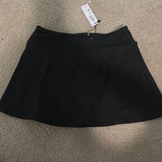 Black Tennis Skirt Brand New From Garage Black Stretch Tennis Skirt With Lining, Black Tennis Skirt For Spring, Black Stretch Lined Skort, Black Stretch Skort With Lined Skirt, Casual Black Lined Tennis Skirt, Black Stretch Flared Tennis Skirt, Black Flared Tennis Skirt With Stretch, Casual Black Stretch Swim Skirt, Black Lined Tennis Skirt For Night Out