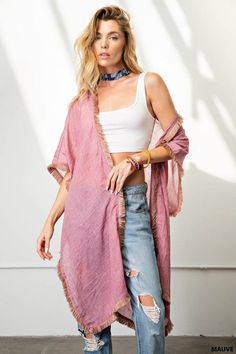 Experience the ease and elegance of our fringe trim kimono. Crafted from a light-weight, soft fabric, this versatile cover-up is perfect for any event. Perfectly suited for dressy occasions and both day and night events, the kimono offers a flattering, loose fit that can be dressed up or down, worn over shorts, jeans, or a beautiful dress. Enjoy the fun and beauty of the fringe trim for an effortless look. Chic Spring Layering Cover-up, Chic Unlined Spring Cover-up, Chic Spring Unlined Cover-up, Spring Wrap Robe For Beach Cover-up, Fall Beach Kimono With Tassels, Spring Loungewear Tunic Kimono, Spring Tunic Kimono For Loungewear, Spring Oversized Shawl Kimono, Oversized Shawl Kimono For Spring