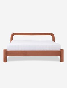 the bed frame is made from wood and has a white sheet on top of it