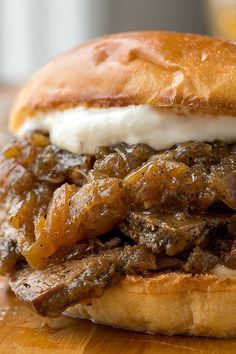 a close up of a sandwich on a wooden table