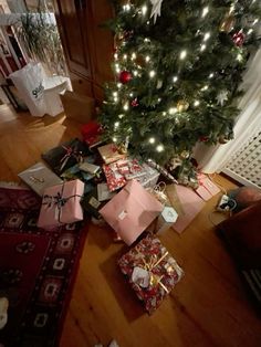 a christmas tree with presents under it