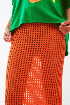 Make a statement with our Maxi Sheer Crochet Skirt in Orange. This stunning skirt is crafted from a blend of 45% viscose, 35% polyamide, and 20% acrylic, offering a comfortable and breathable fit. The bodycon fit and high waist rise enhance your curves and create a flattering silhouette. The midi length adds an elegant touch, while the sheer crochet design exudes boho vibes. The elastic waist ensures a secure and comfortable fit. Our model, with measurements 31-24-35 and a height of 5'10", is we Summer Mesh Mini Skirt, Summer Stretch Mesh Skirt, Spring Mesh Mini Skirt, Summer Fitted Knit Skirt, Fitted Knit Skirt For Summer, Summer Pointelle Knit Bottoms, Summer Stretch Pointelle Knit Bottoms, Knit Mini Skirt For Summer, Spring Pointelle Knit Skirt