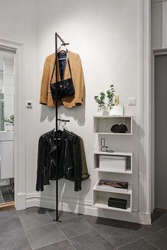 an image of a clothing rack with clothes on it