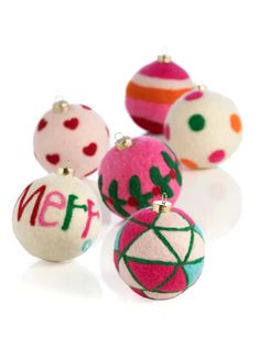 christmas ornaments with the word merry written on them in different colors and sizes, including balls