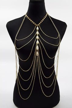 Stay hot this summer in the Adelynn Bikini Tassel Pearl Body Chain. This layered statement necklace features a gold-tone metal link base, drapey chain, and layered bib silhouette. Delicate pearls accent the center. It can be worn with a top tube dress or a bikini as an outfit. A summer body chain with a perfect sense of fashion, why not try it?  One Size fits all  Colour may vary due to lighting on images Bralette Chain, Pearl Body Chain, Gold Body Chain, Gold Bodies, Gold Bead Necklace, Party Summer, Layered Chains, Perfect Sense, Chain Fashion