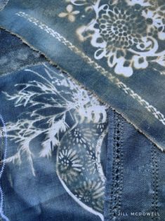 an old pair of jeans has been altered to look like fabric with flowers on them