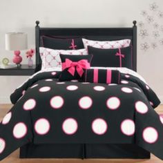 black and pink bedding with white polka dots