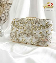 For any assistance or query whatsapp us at +9-9079290206 or mail us at heertheweddingstore@gmail.com White Handwork Rectangular Evening Bag, White Rectangular Evening Bag With Handwork, Rectangular Hand Embellished Wedding Bag, Elegant White Bag With Intricate Embroidery, Elegant White Bags With Intricate Embroidery, White Handwork Rectangular Bag, Elegant White Bag With Zari Work, White Rectangular Bag With Handwork, White Rectangular Bag For Reception