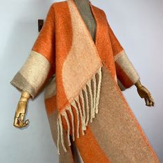 This super soft and warm wool cardigan kimono is perfect for the cold weather. Unlike other sweaters and wools, the wool used for this beauty is non itchy. Think of your favorite throw blanket, the comfort and warmth it gives but 10x stylish and wearable any where. This kimono is all that and more! One size fits S-4X Material: Wool One Size Fits Most Size Chart Fall Lambswool Sweater For Layering, Wool Shawl Outerwear For Winter, Beige Shawl Collar Sweater Coat For Fall, One Size Winter Acrylic Sweater Coat, One Size Acrylic Sweater Coat For Winter, Acrylic Poncho Shawl For Fall, Acrylic Shawl Poncho For Fall, Wool Cardigan With Shawl Collar For Fall, Wool Shawl Collar Cardigan For Fall