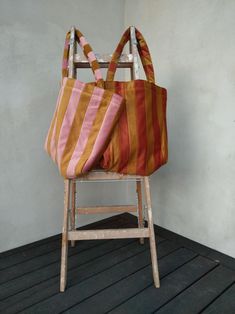 This Tote Bag is the perfect accessory for your casual uses and travels or days at the beach. Made from  coloured stripes of velvet, make your design unique.  It is both stylish and practical. - Made from velvet - Large zip inside for closing & securing the bag - Strong straps - Smaller pocket inside - Large universal size Size: Height: 16 inches (40 cm )  Width: 22/16 inches (55/40 cm)  Depth 5.5 inches (14 cm) Multicolor Travel Bags With Dust Bag, Reversible Bucket Bag For Travel, Reversible Bucket Travel Bag, Travel Canvas Bucket Bag Gift, Travel Bucket Canvas Gift Bag, Orange Pouch Bag For Travel, Orange Travel Pouch Bag, Summer Orange Bag For Everyday Use, Orange Bucket Beach Bag For Everyday Use