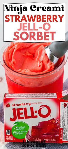 strawberry jell - o sorbet in a glass bowl with a spoon next to it