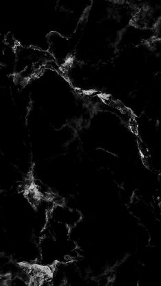 black and white marble textured wallpaper with some light coming from the top right corner