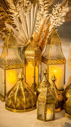 decorative gold lanterns and wheat stalks on a table