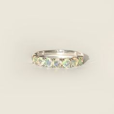 Soft yet full of color, this lovely 7-stone ring features natural Ethiopian opal crafted in 14K gold. - Stone info: natural opal - Total ct weight: 1ct approx. - Finish: choice of yellow, rose, or white. - Made in 14 karat gold. - Stamp with 14K. ❤️Visit our official website for exclusive new products.      https://elekalonjewelry.com/ ❤️Follow us on Instagram @ elekalonjewelry for the latest projects and much more! ❤️If you have any questions, please feel free to message us. . Anniversary Multi-stone Opal Ring, Green Opal Ring For Anniversary, Wedding Multi-stone Ring With Ethiopian Opal, Ethiopian Opal Ring For Wedding, Ethiopian Opal Multi-stone Ring, Anniversary Green Opal Ring, Ethiopian Opal Anniversary Ring, Anniversary Multi-stone Ethiopian Opal Ring, Anniversary Ethiopian Opal Multi-stone Ring