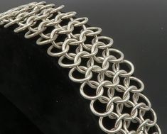 "925 Sterling Silver - Vintage Interlocking Circle Link Chain Bracelet - BT4827  925 Sterling Silver - Vintage Interlocking Circle Link Chain Bracelet - BT4827  Jewelry Type:         Bracelet   Metal Type:            925 Silver  Metal Size:             7.5\" Length  1.25\" Height   Stone Type:            N/A  Condition:              N/A  Jewelry Weight:     73.1 Grams  PLEASE NOTE: THIS ITEM IS PRE-OWNED. ALTHOUGH MOST ITEMS ARE IN VERY GOOD CONDITION, SOME MAY NEED CLEANING AND/OR MINOR REPAIRS. WE MAKE A VERY STRONG EFFORT TO UPLOAD CLEAR PICTURES. PLEASE INSPECT ALL PICTURES AND ASK ALL QUESTIONS YOU MAY HAVE PRIOR TO MAKING A PURCHASE. NOT ALL STONES ARE GENUINE, SOME ARE ENHANCED OR CREATED." Elegant Chain Link Bracelets With Jump Ring, Silver Link Bracelet With Jump Ring, Elegant Link Bracelets With Jump Ring, Silver Chain Bracelet With Jump Ring, Chainmaille Tutorial, Chain Maille Jewelry, Bracelet Metal, Link Chain Bracelet, Metal Bracelets