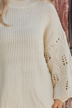 This Crochet Sleeve Pullover Sweater in Cream offers a chic blend of texture and style! Featuring long balloon sleeves with intricate crochet detailing, this sweater adds a unique flair to any outfit. It has a round neckline with ribbed detailing at the neckline, cuffs, and hem, enhancing its cozy feel. Designed with an oversized fit, it's perfect for layering and everyday comfort. Style with jeans, ankle booties, and a wide brim hat for an elevated chic outfit. Revival Clothing, Fall Style Guide, Intricate Crochet, Gameday Dress, Loungewear Dresses, Casual White Dress, Game Dresses, Chic Outfit, Wide Brimmed Hats