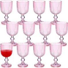 a bunch of wine goblets sitting next to each other on a white background