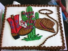 a birthday cake with cowboy boots on it