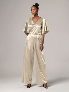 This soft satin jumpsuit features a flattering v-neck design, making it the perfect choice for mothers of the bride. Its dress pantsuit style provides comfort and elegance, while its high-quality material ensures a polished look. Stay stylish and comfortable on that special day with our jumpsuit. Dress Pantsuit, Bride Jumpsuit, Elegant Jumpsuit, Dress Pant Suit, Satin Jumpsuit, Pant Suits, Jumpsuit Elegant, Mother Of Bride, Peacock Green