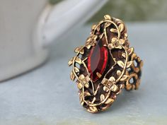 Beautiful Victorian style antiqued brass ring with sparkle ruby red Swarovski glass jewel set in center. All metal parts are brass based and are torch soldered together.    Measurement, Adjustable band that fits U.S size 6 to 10. Dark Victorian, Ring With Ruby, Ruby Red Color, Bijoux Art Nouveau, Dark Rose, Pink Swarovski, Fashion Jewelry Sets, Brass Ring, Victorian Jewelry