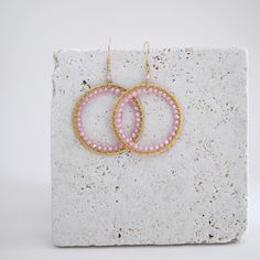 Rose quartz gemstone hoop earrings - 2.5" long- French hooks- 14k gold plated .925 fine Italian sterling silver - Made in the USA in our NYC studio- Packaged in a gift box- Free shipping on US orders Handmade to last. Our unique gold plating technique makes our jewelry tarnish resistant. The nature of natural gemstones makes each style one-of-a-kind. Modern Pink Small Hoop Earrings, Modern Pink Small Hoop Jewelry, Modern Wire Wrapped Hoop Earrings For Gift, Pink Wire Wrapped Round Earrings, Handmade Small Hoop Rose Gold Earrings, Handmade Small Hoop Crystal Earrings, Bohemian Pink Circular Jewelry, Bohemian Pink Circle Jewelry, Modern Wire Wrapped Round Hoop Earrings