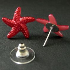 Fuchsia Red Starfish Earrings. Star Earrings with Silver Stud Earring Backs.A pair of fuchsia red starfish with a hint of pink and a soft sheen to their surface have been set on silver plated post earrings complete with matching earring backs.These earrings are available in a variety of colors! http://etsy.me/1DuDuC3Starfish Size: 19mmIf you would like to order a larger quantity than what's offered in this listing, please contact me for availability!Stop by and visit http://stumblingonsainthood. Red Star-shaped Earrings For Party, Red Star-shaped Party Earrings, Nickel-free Red Star Earrings, Red Star-shaped Nickel-free Earrings, Earrings Star, Starfish Earrings, Handmade Design, Star Earrings, Earring Backs