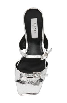 A bold, metallic sandal features an exaggerated square toe and crystal embellishments designed to extend beyond the foot for an on-trend favorite for warm-weather styling. 4" heel Synthetic upper and lining/rubber sole Imported Chic Silver Square Toe Heels, Modern Silver Heels With Buckle Closure, Summer Rhinestone Heels With Square Toe, Modern Silver Sandals For Night Out, Modern Silver Heels With Square Toe, Glamorous Silver Heels With Buckle Closure, Glamorous Silver Heels With Square Toe, Silver Sandals With Branded Heel Counter, Chic Metallic Synthetic Sandals