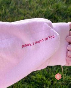 This Jesus I Trust In You pink sweatshirt will keep you warm in the colder months. A pre-shrunk, classic fit sweater that's made with air-jet spun yarn for a soft feel. The inside of the left wrist has embroidery which reads, "Jesus I Trust In You". Look at this message as a constant reminder of the love and mercy our Lord pours upon us each day. .: 50% cotton, 50% polyester .: Pre-shrunk .: Unisex, Classic fit .: Rib knit collar with spandex .: Double-needle stitched collar, shoulders, armholes Pink Christian Sweatshirt, I Love Jesus Shirt, Christian Clothing Design, Christmas Christian Shirt, Embroidery Sweatshirt Designs, Jesus I Trust In You, Christian Boutique Ideas, Christian Sweatshirts For Women, Cute Christian Sweatshirts