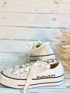 These Custom Converse shoes are sure to make your big day extra unique and comfy, they are a perfect gift for your bridesmaids and even for the whole wedding party. ✨✨Designs and Texts✨✨ ⭐️ You can choose one of our texts in the personalization section or message us with your own words. ⭐️ If you like a different design message me and I will be happy to work with you to create unique shoes for you. ⭐️ If you want a different color of shoes message me and I will try my best to get them for you. ⭐️ Want a different text color, no problem message me and will get it for you. ✨✨Ribbon Color and Length✨✨ ⭐️ For the Low top style, we use White Satin ribbon 51" in Length and 2 CM wide / let me know if you want a longer one. ⭐️ For High Top style, we use White Satin Ribbon 55" in Length and 2 CM wi Customizable Lace-up Wedding Shoes For Bride, Platform Bridal Shoes, Sneaker Gift Ideas, Bride Converse, Custom Converse Shoes, Converse Wedding Shoes, Custom Wedding Shoes, Bridal Sneakers, Converse Platform