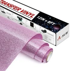 a roll of pink glitter tape sitting on top of a box