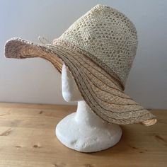 Lightweight Two-Tone Woven And Braided Straw Sunhat. This Has A Wide, Floppy Brim, And Open Weave Light Raffia Crown With Twisted Twine Finish In A Bow. The Hat Has An Adjustable Hook & Loop Strap To Fit Most Head Sizes. Brand New With Tags. Inner Diameter: 57 Cm Bohemian Straw Hat For The Beach, Bohemian Straw Hat For Beach, Casual Cream Straw Hat For Beach, Cream Wide Brim Crochet Hat For Beach, Cream Wide Brim Crochet Hat For The Beach, Beige Wide Brim Crochet Hat For Warm Weather, Cream Sun Hat For Spring, Beige Crochet Hat With Wide Brim For Warm Weather, Curved Brim Neutral Hat For The Beach