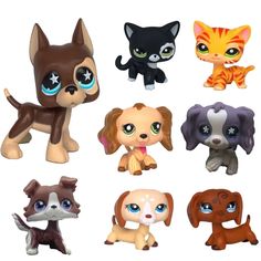 the littlest pet shop toys are all different colors and sizes, including black, brown, blue eyes