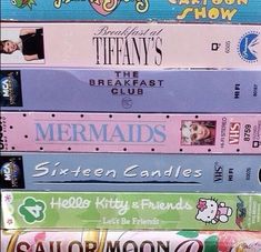 a stack of books sitting on top of each other in front of a sign that says mermaids